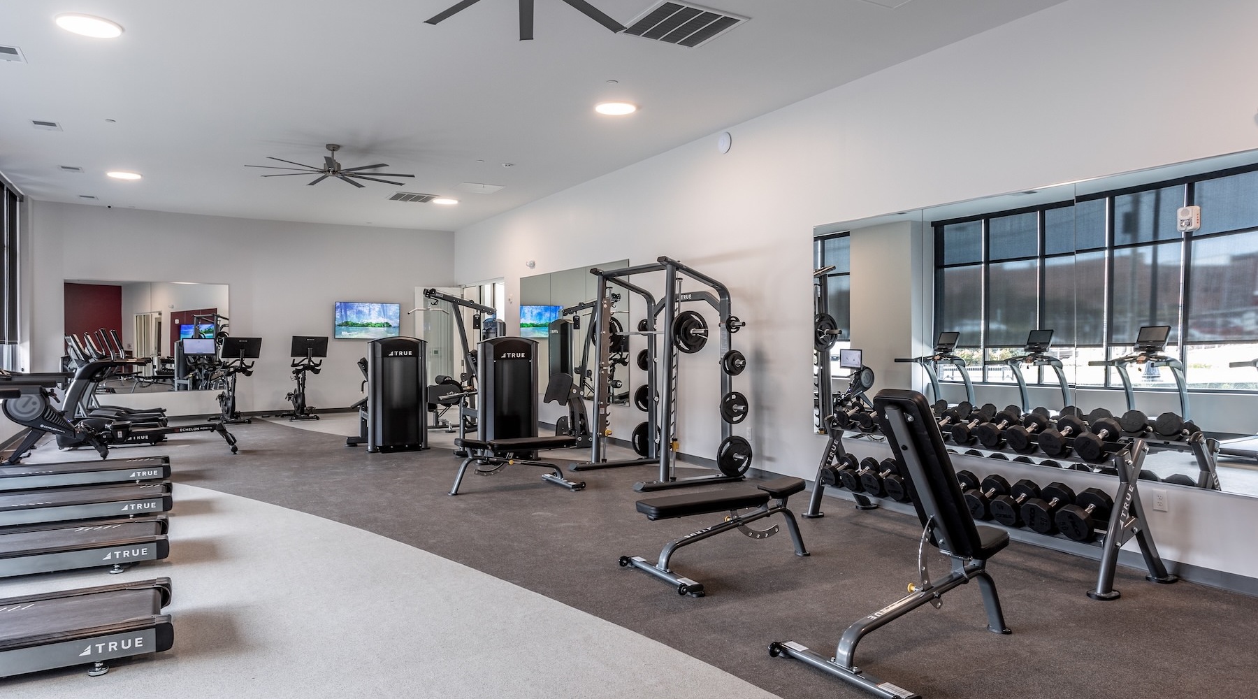 a gym with treadmills and treadmills