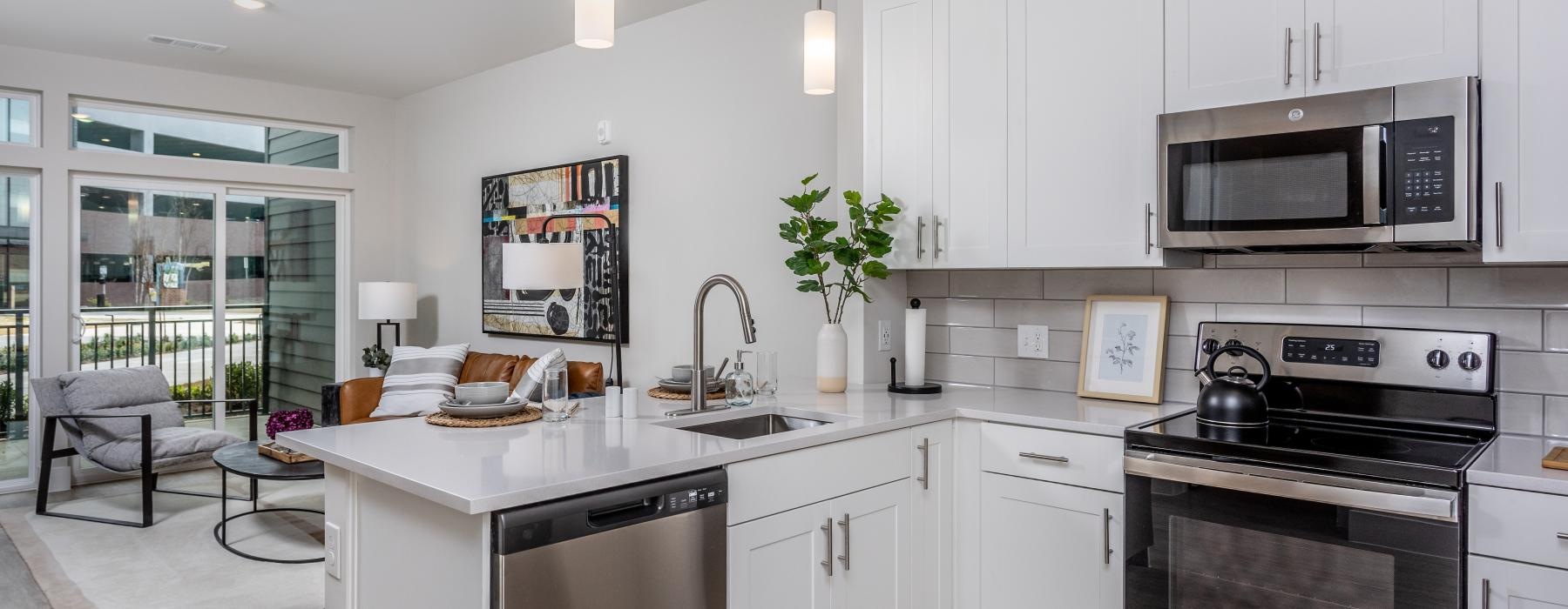a kitchen with white cabinets