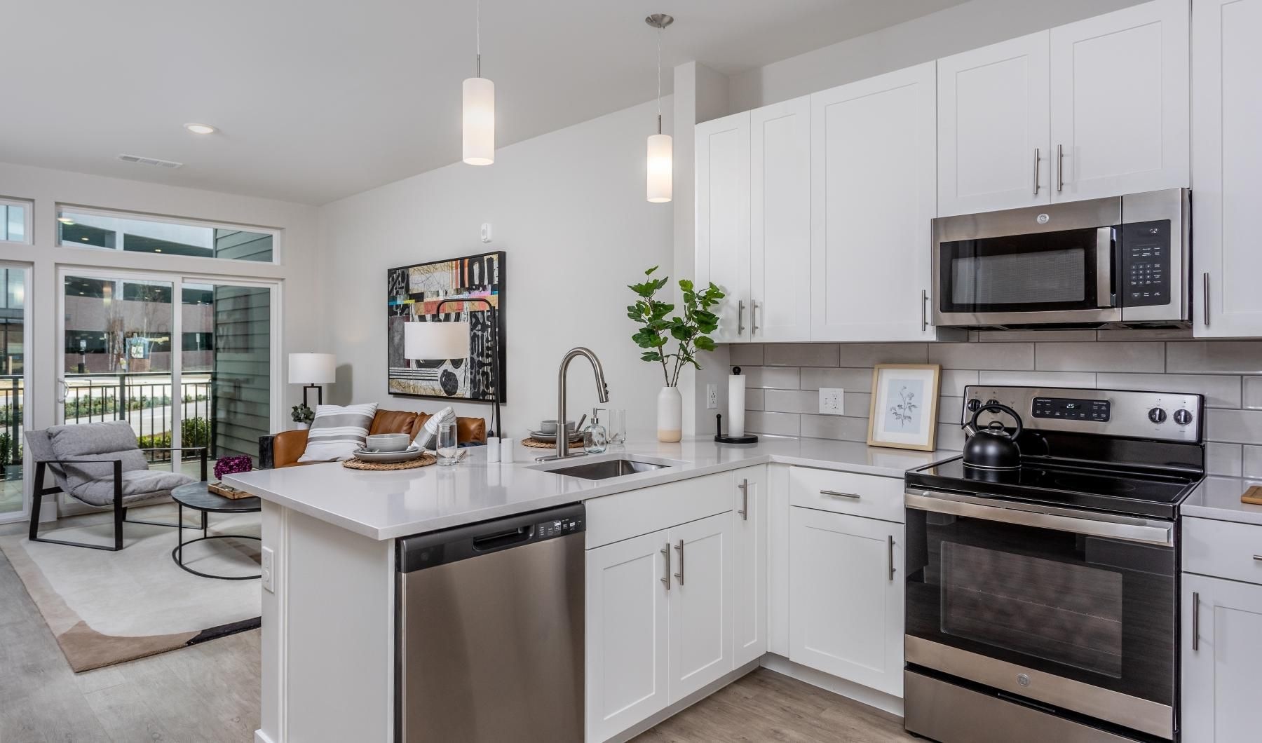a kitchen with white cabinets
